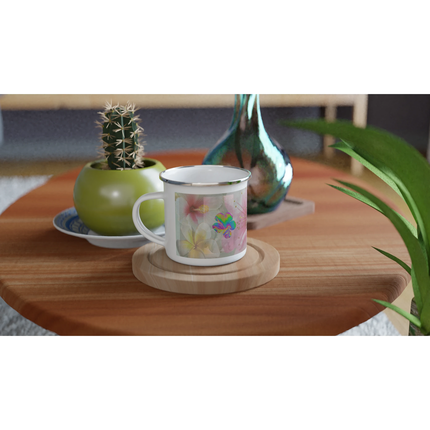 12oz Bloom, Baby, Bloom! floral enamel mug with silver rim on a cozy wooden table, surrounded by plants, a cactus, and decorative vases. Perfect for coffee or tea.