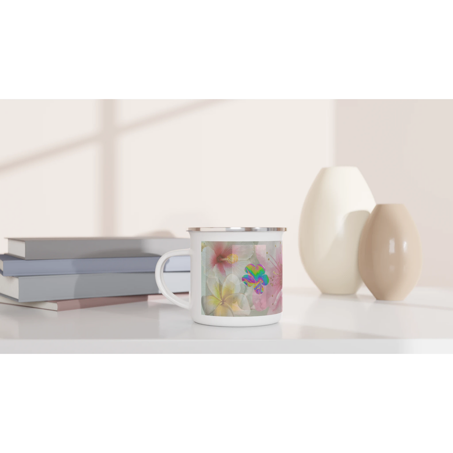 12oz Bloom, Baby, Bloom! floral enamel mug with silver rim styled on a modern desk with books and ceramic vases. Aesthetic coffee and tea cup for home or work.