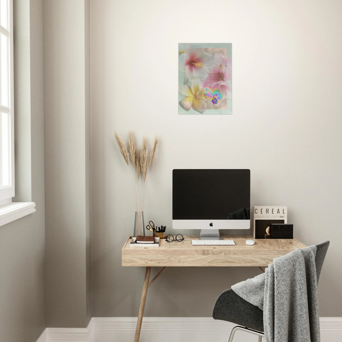 Surreal floral art poster displayed above a light wood desk in a cozy home office, styled with modern decor and soft natural light.