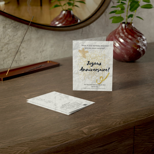 French birthday card with gold scribble design displayed on a wooden desk, perfect for stylish, joyful celebrations.