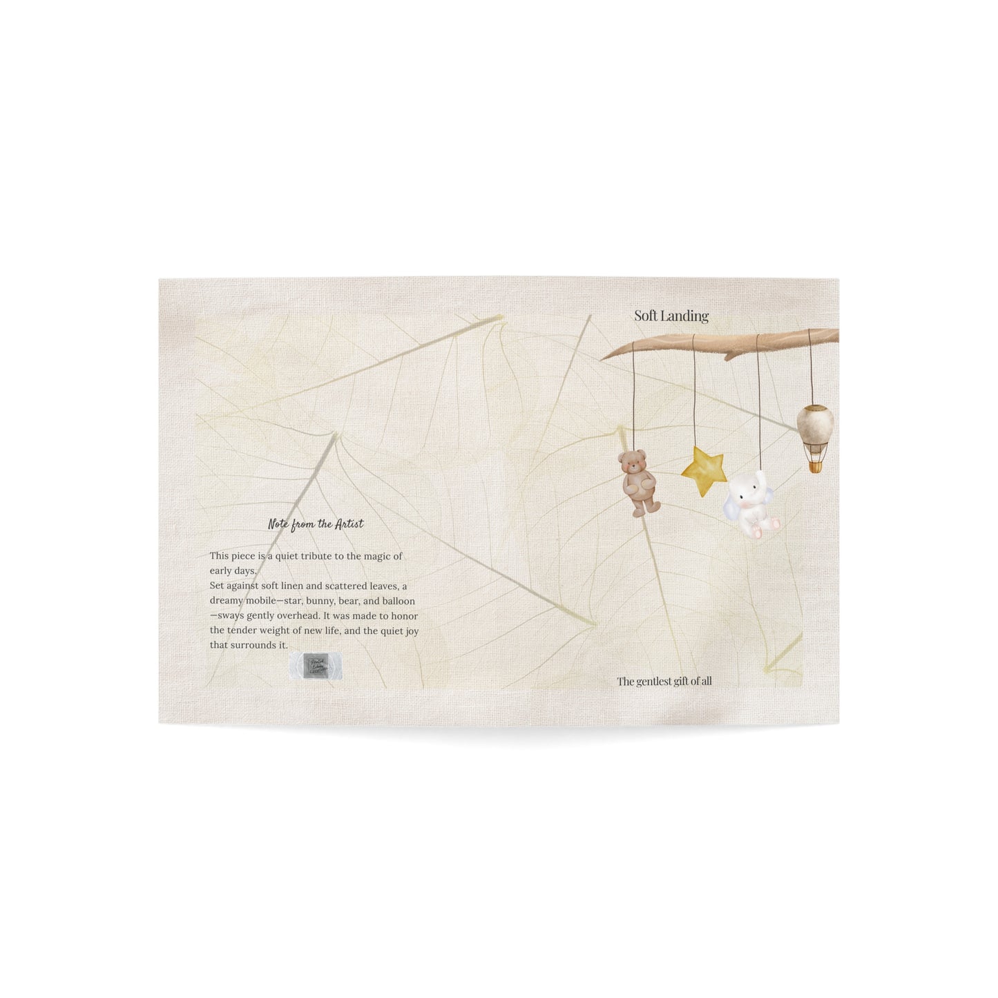 Flat lay of Soft Landing baby card fully open, showcasing both front cover with mobile design and back with artist note—set on soft linen with natural leaf texture. A gentle and elegant newborn keepsake.