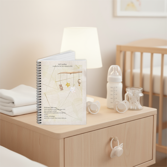 Soft Landing baby journal resting on a wooden nursery nightstand, designed as a keepsake journal for newborn memories and early parent reflections.