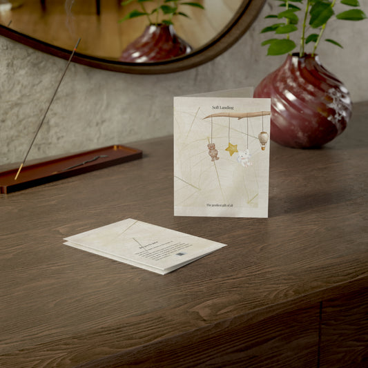 Soft Landing baby card displayed on a wooden table beside a modern ceramic vase and mirror — a serene and elegant gift for baby showers and new parents.