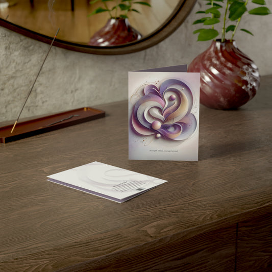 Strength Within card displayed upright on a wooden desk next to its envelope and sculptural décor, capturing an atmosphere of empowerment and elegance.