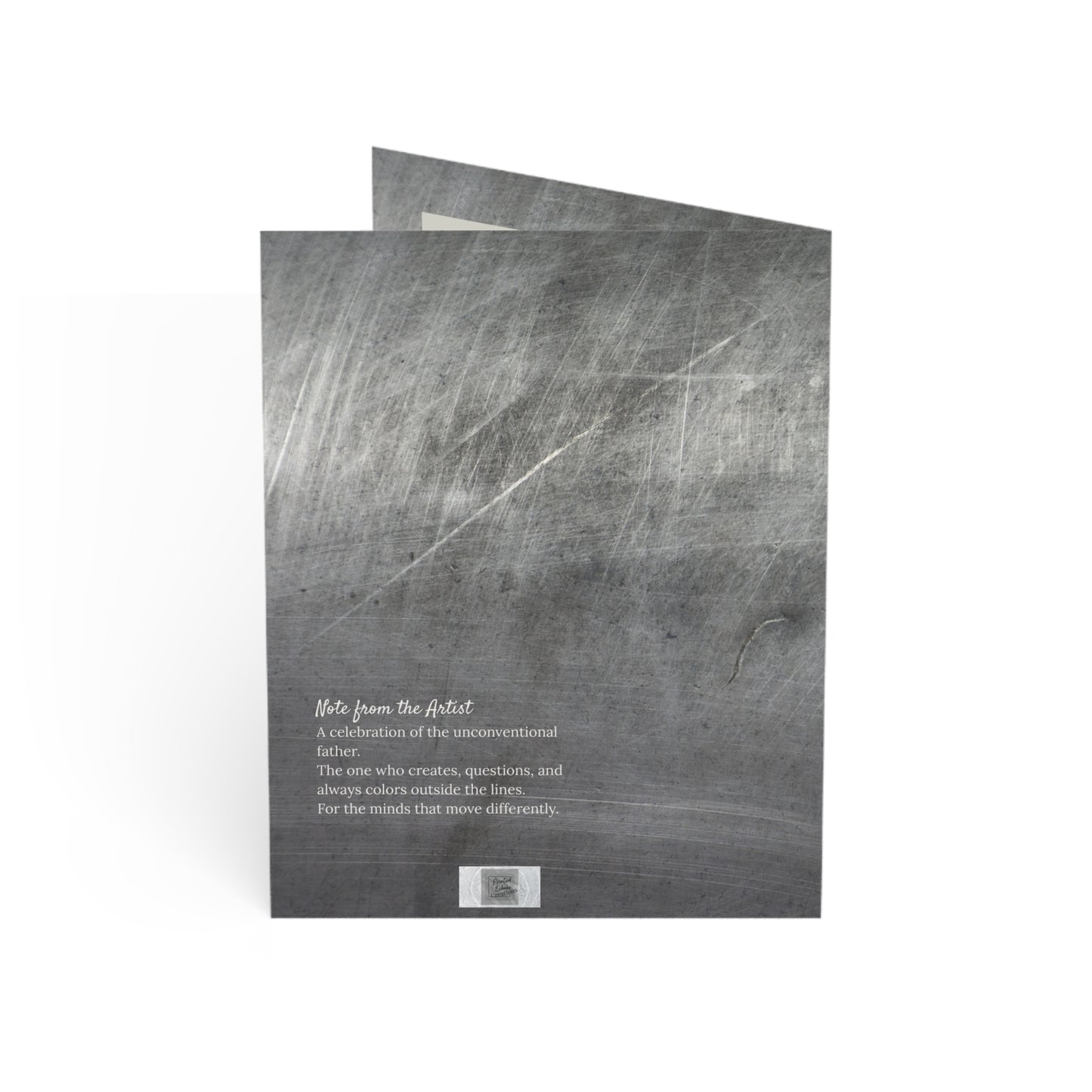 Back of “The Original” greeting card showing a note from the artist. Set over a brushed steel texture, this card celebrates dads who break molds and lead with imagination