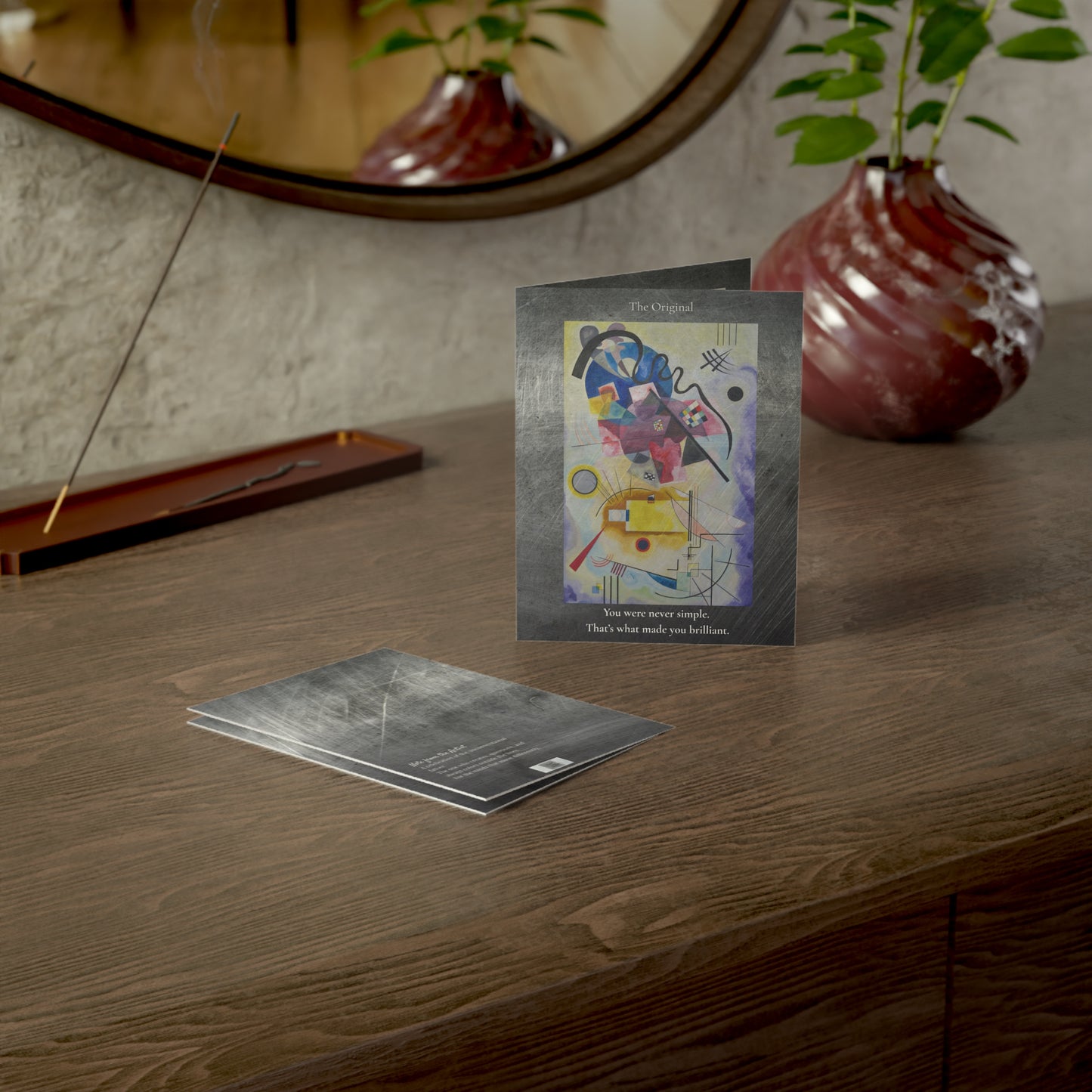 “The Original” card styled on a wood plank floor, surrounded by warm natural light. A striking abstract greeting card for dads who walk their own path.