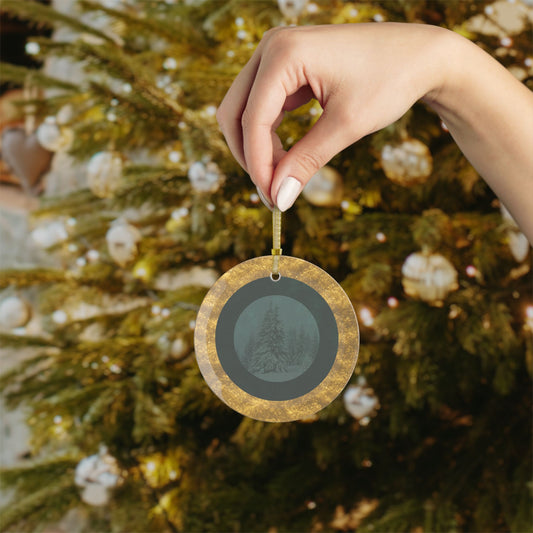 hand holding Velvet Solstice glass ornament with snowy fir design, green velvet background, and gold border in front of Christmas tree, holiday décor by Printed Echoes Creations