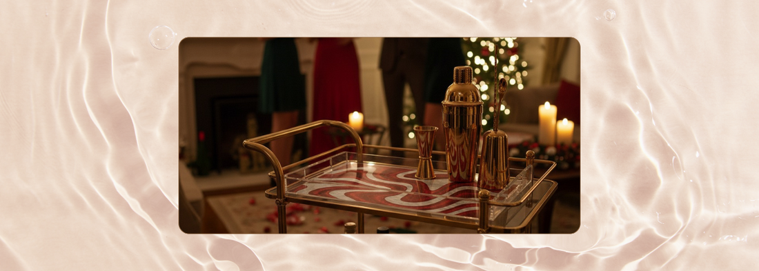 Candy Swirl holiday tray with red and white swirl design, styled on a festive bar cart with golden cocktail tools, candles, and a Christmas tree in the background.