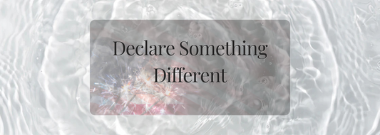 Soft banner image with glistening water and sparkler lights beneath the words “Declare Something Different”—a poetic invitation to intentional living and gifting.