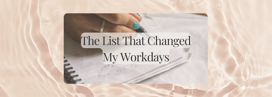 A soft pink marbled background with a close-up of a hand writing in a notebook. Overlaid text reads: “The List That Changed My Workdays.” Minimal and calming design, styled for a reflective blog article.