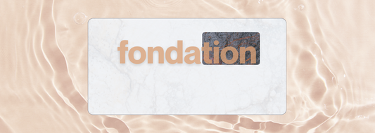 Fondation capsule blog banner featuring the word “fondation” in terracotta lettering on a cream marble background with lava stone detail — design inspiration by Printed Echoes Creations.