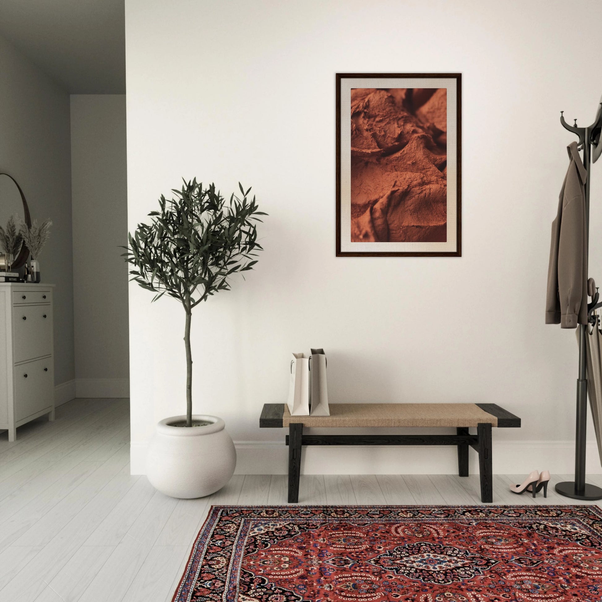 Origin terracotta framed canvas wall art displayed in a modern entryway with an olive tree, bench, and Persian rug — abstract artwork adding earthy warmth and sophistication to transitional home decor.