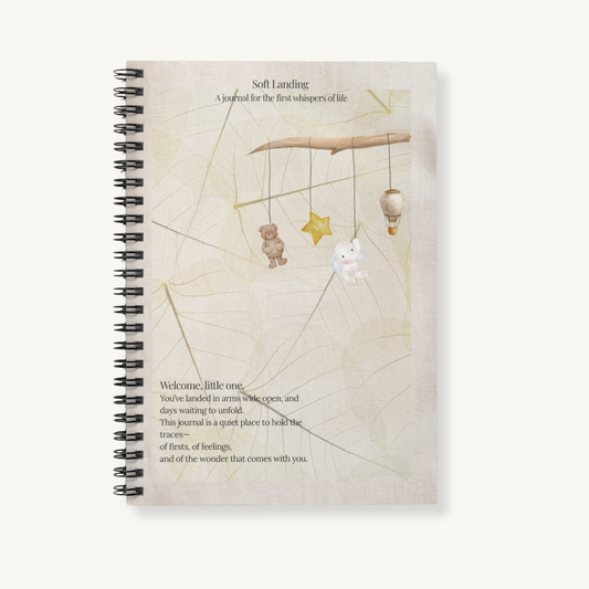 soft landing journal styled on a soft fabric background - a gentle, gender neutral memory book for first moments and newborn gifting