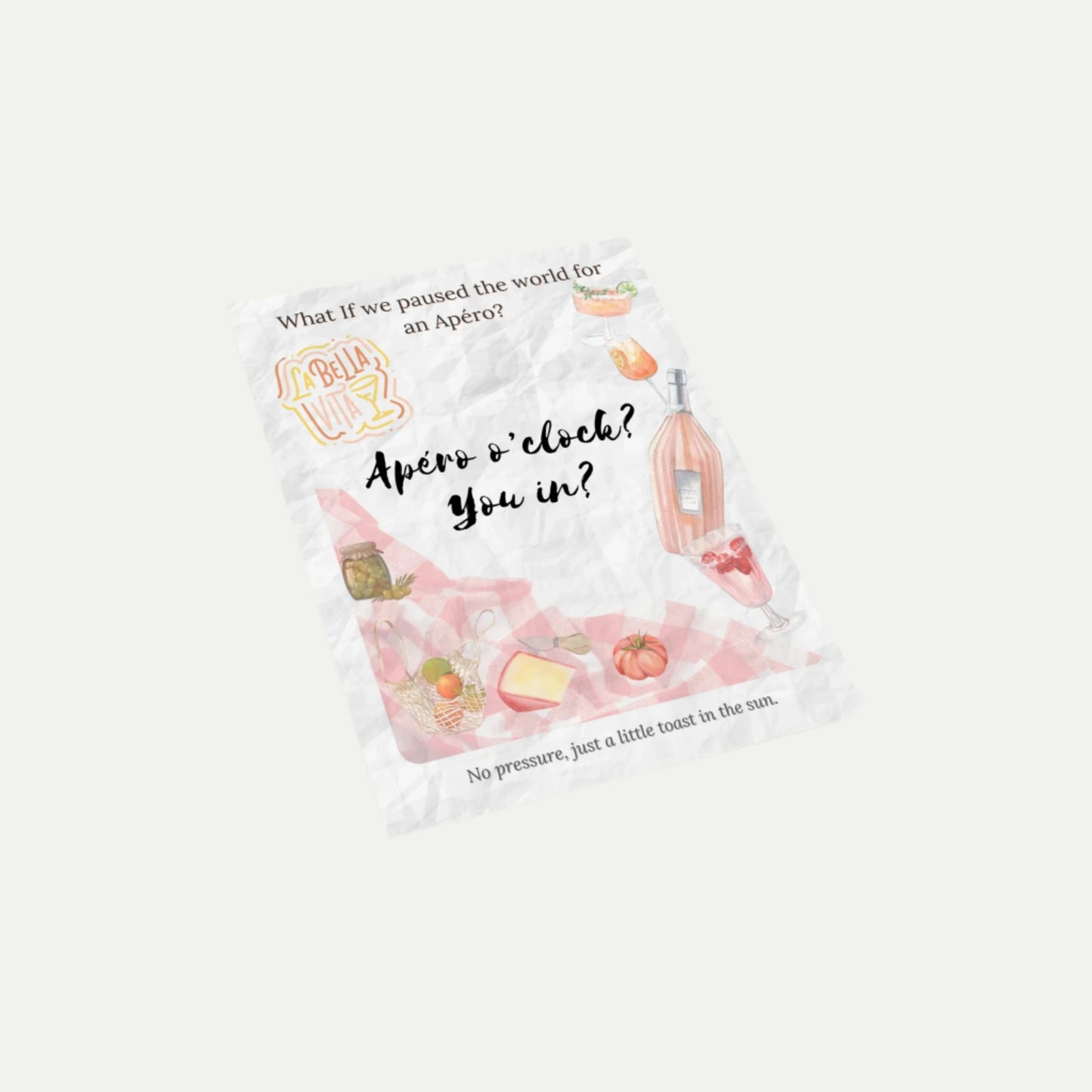 Front of the What-If Apéro Invite card by Printed Echoes Creations shown at an angle, featuring summer picnic illustrations, handwritten invitation text, and a poetic tagline.