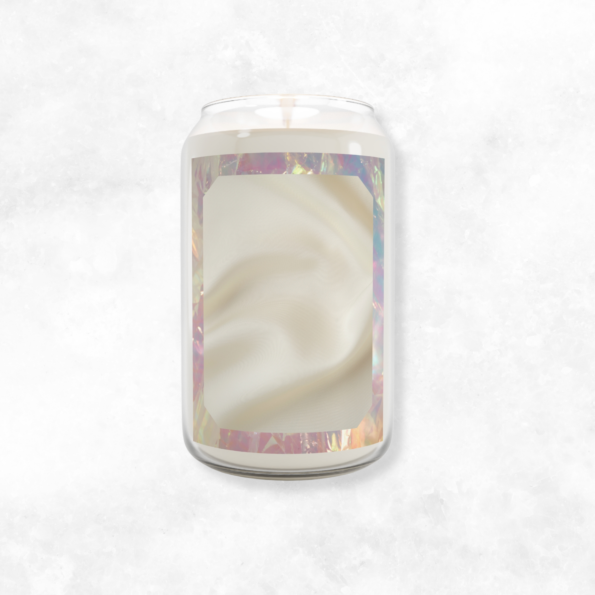 soy wax Return Glow candle in amber jar with abstract silk-inspired label and holographic edges, placed on white marble
