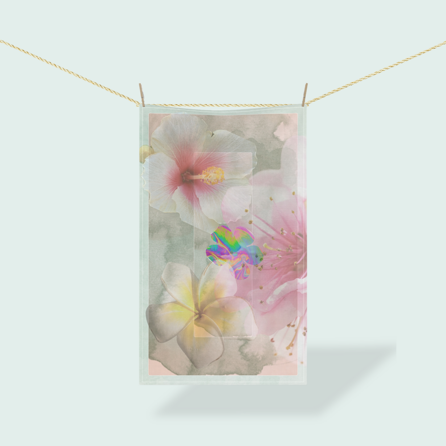 Artistic tea towel featuring Bloom, Baby, Bloom! floral design, hanging on a line with soft pastel flowers and abstract textures in a light, airy setting.
