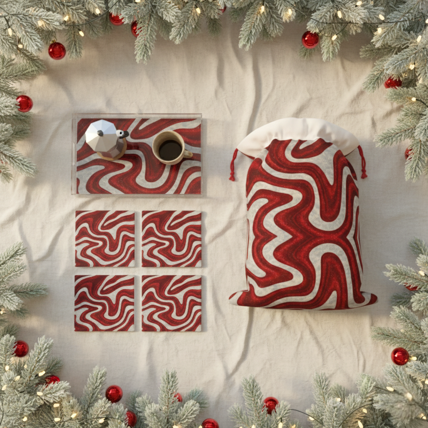 Flat lay of Candy Swirl reusable fabric gift bag with matching red and white coasters, styled with holiday greenery and ornaments — sustainable Christmas gift wrap and eco-friendly décor from Printed Echoes Creations