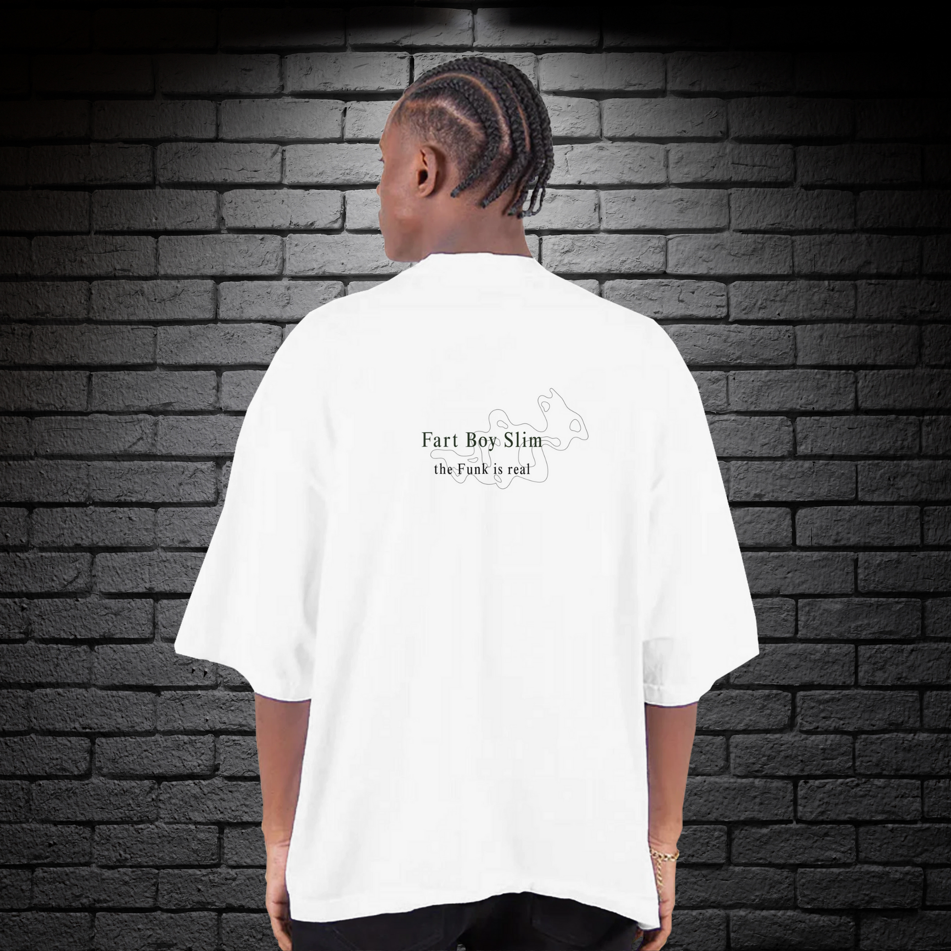 Back of white Fart Boy Slim tee featuring “the funk is real” text and minimalist puff graphic, worn against a black brick wall.

