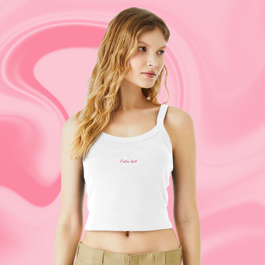 Woman wearing Fartie Girl cropped tank top with pink swirl background. Funny Barbie-inspired summer shirt. Barbiecore meets chaos energy in the most wearable way.