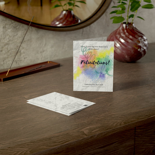Félicitations card displayed on a wooden desk with envelope—ideal for graduations, promotions, and feel-good wins.

