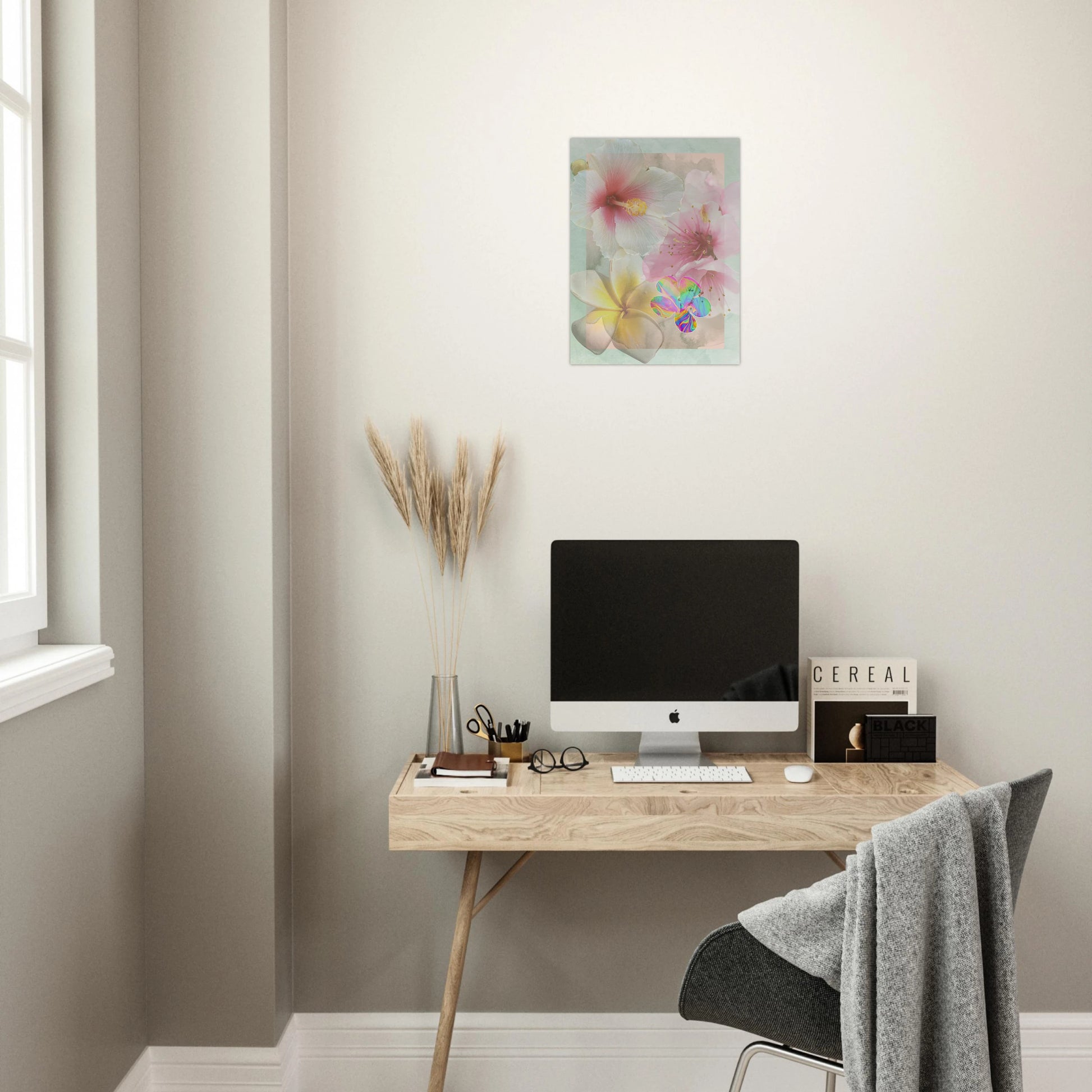 Surreal floral art poster displayed above a light wood desk in a cozy home office, styled with modern decor and soft natural light.