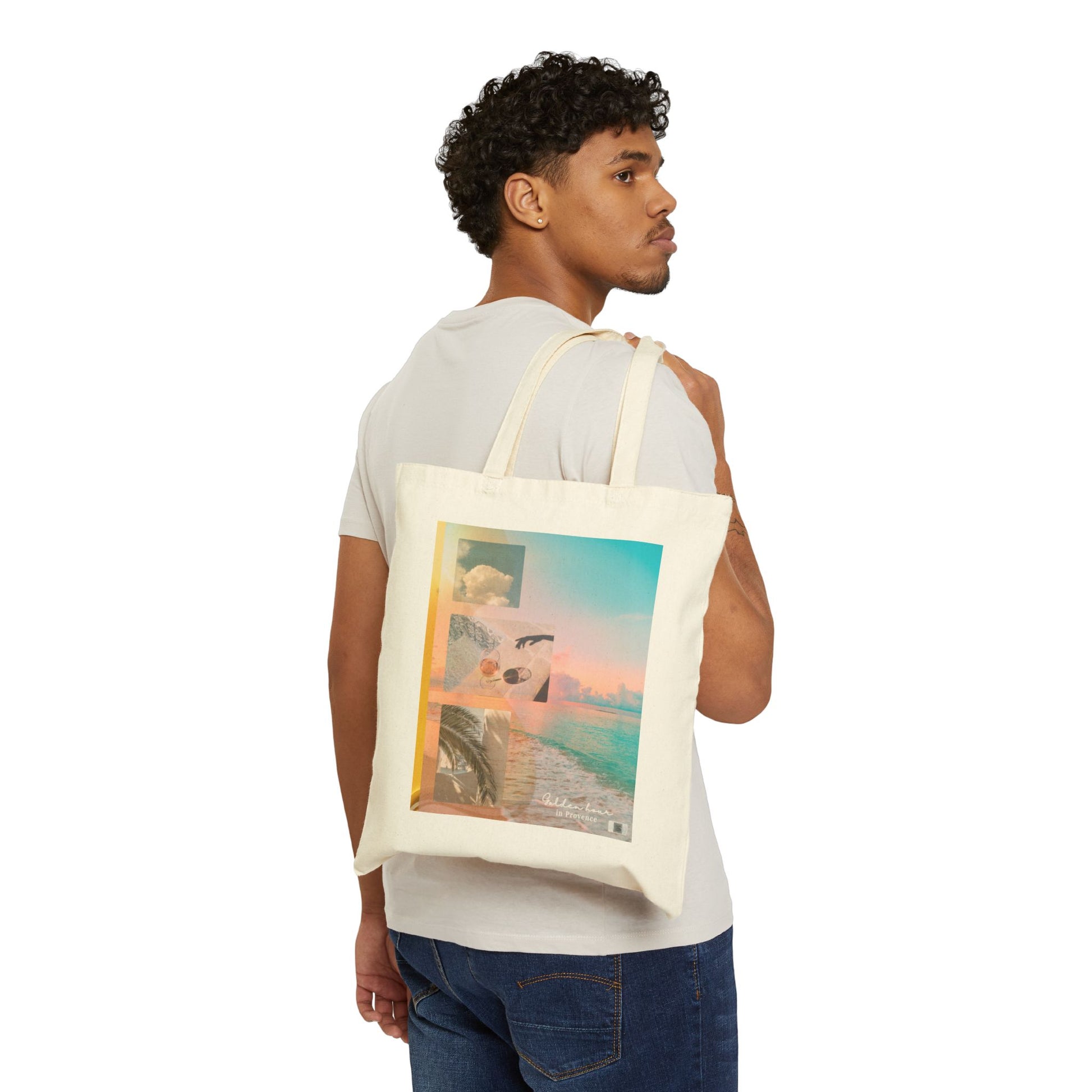 A person wearing the Golden Hour in Provence cotton tote bag over the shoulder, showcasing front side with the soft collage print in a minimalist studio setting.