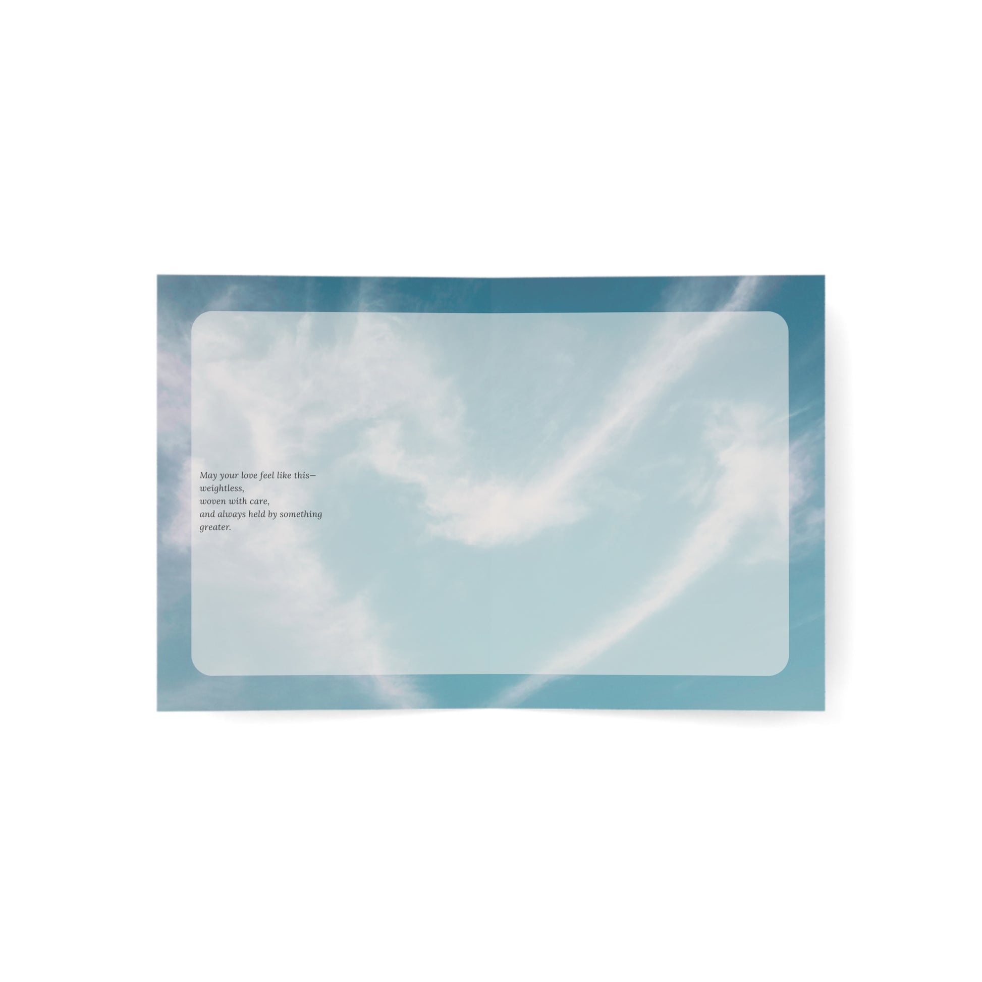 Open view of the Held in Lightness wedding card showing a poetic message against a soft blue sky background. A minimalist, ethereal design reflecting gentle devotion.
