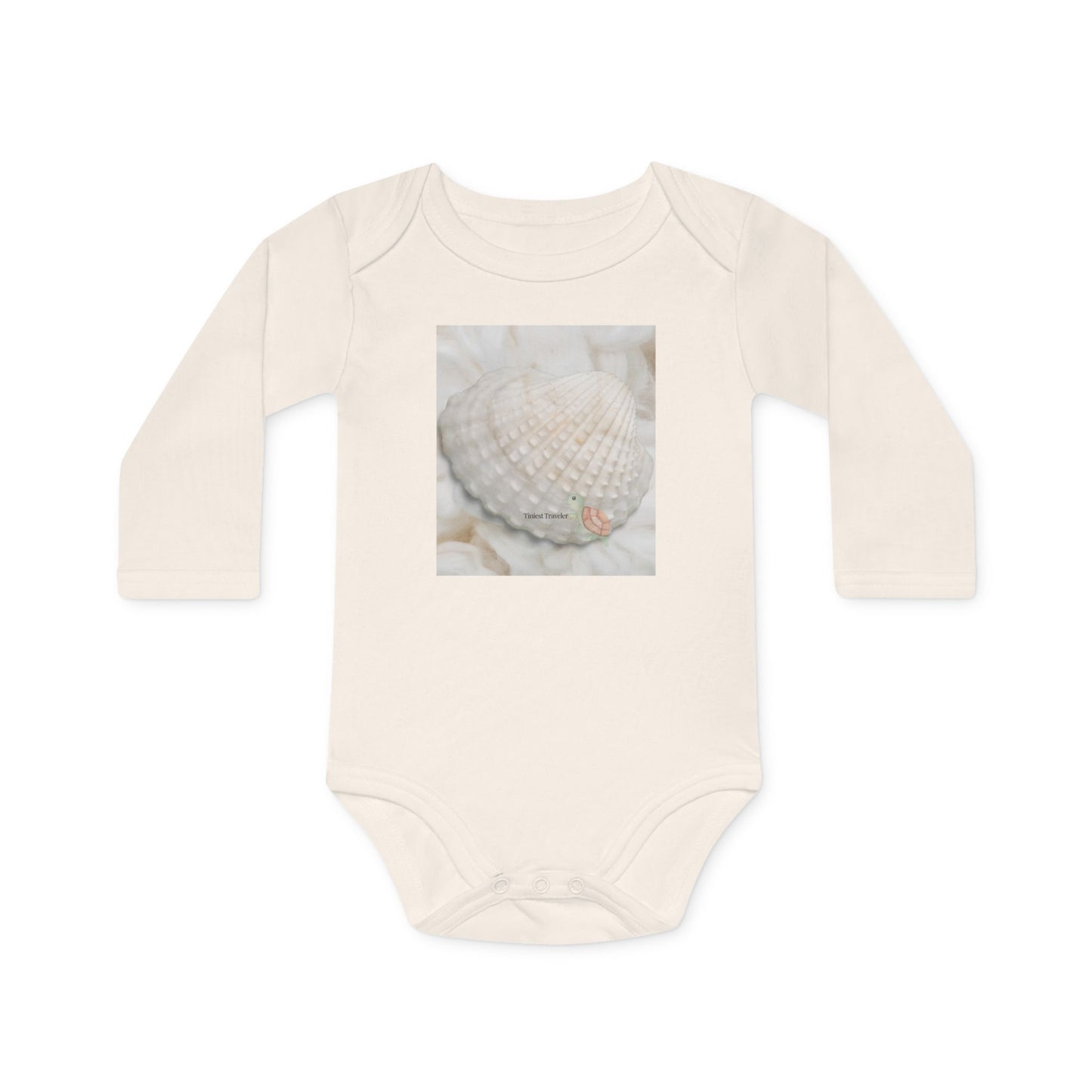Front of the organic natural baby bodysuit with the Tiniest Traveler print and turtle detail.