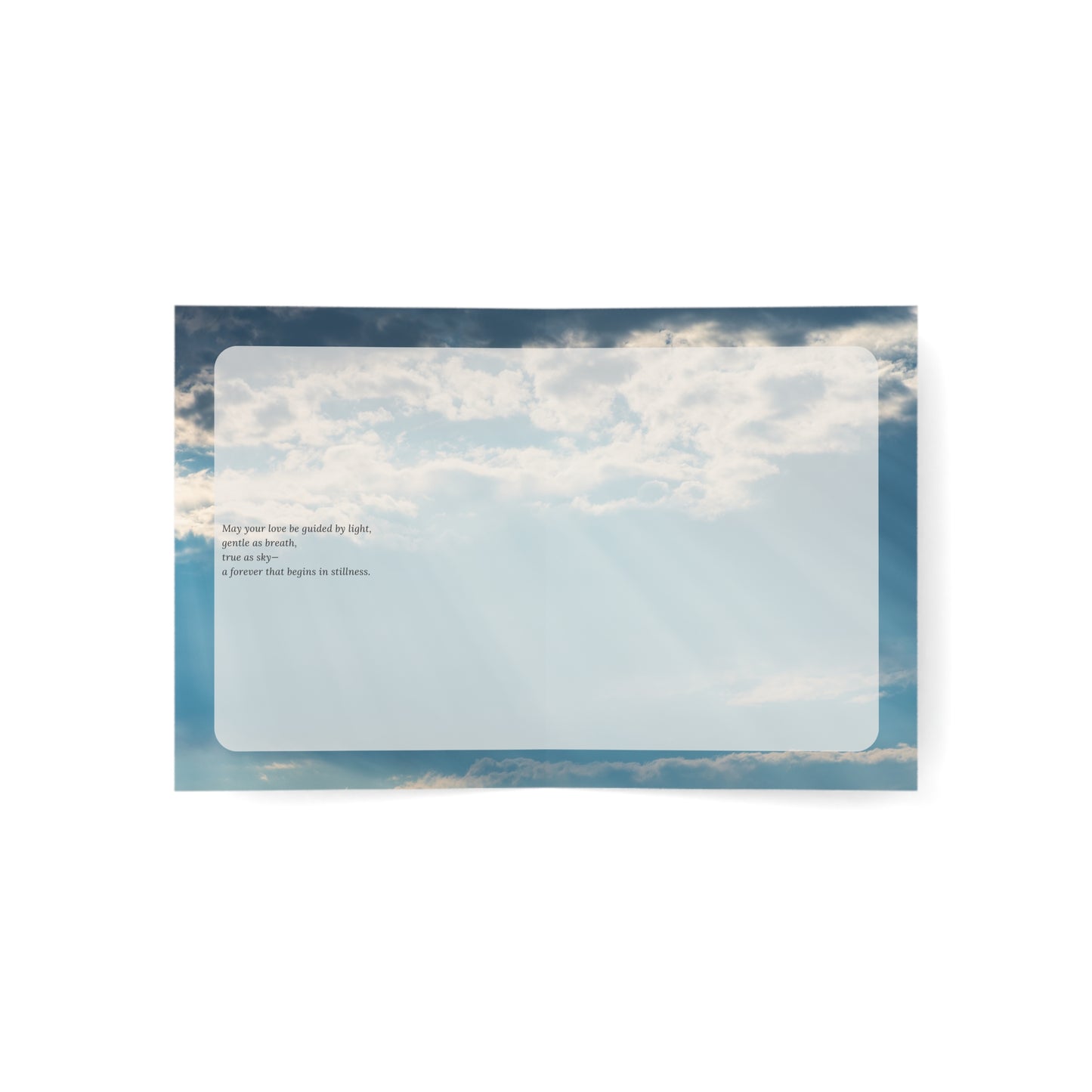Open view of the Sacred Light artistic wedding card showing a soft blue sky with clouds and a poetic message about love, stillness, and forever.