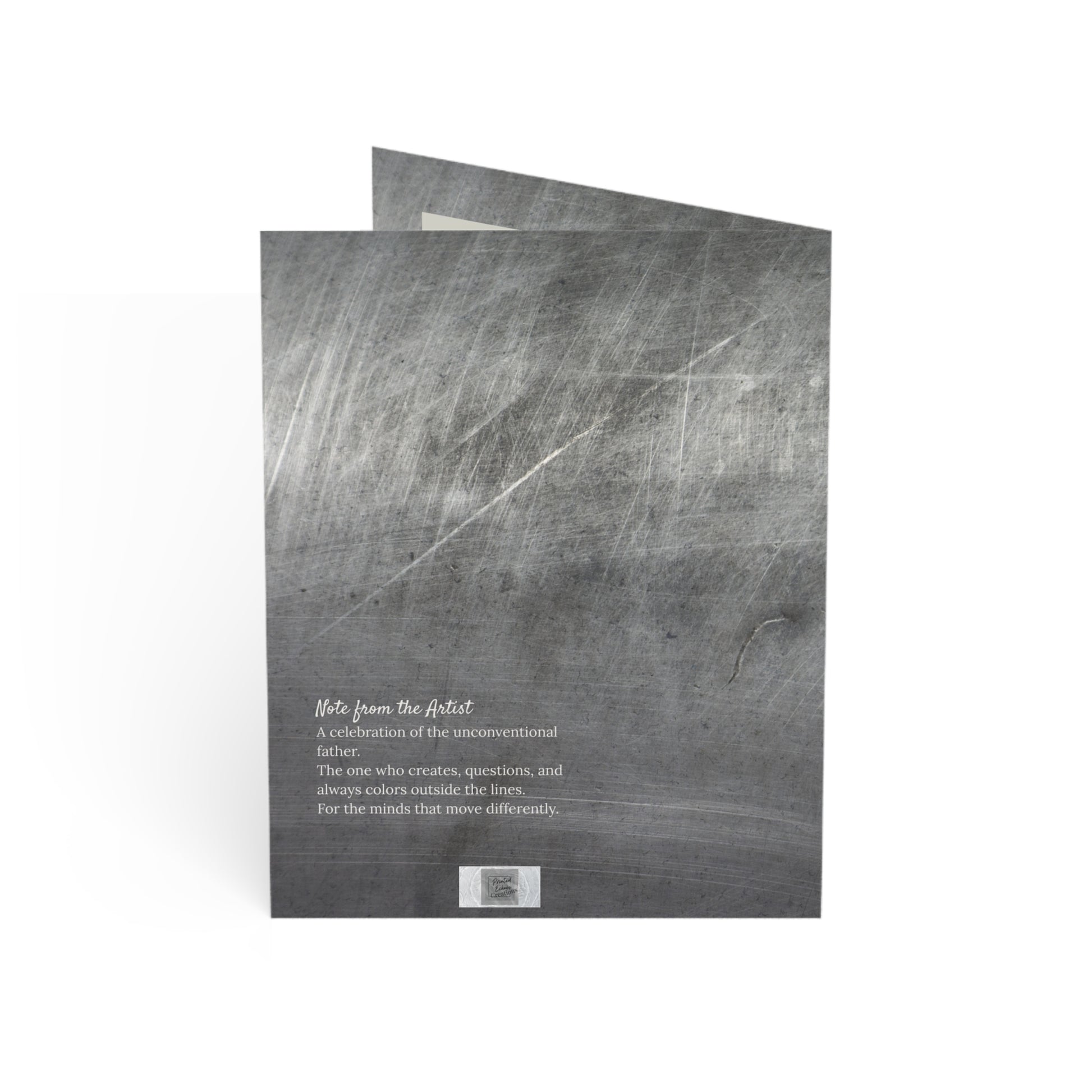 Back of “The Original” greeting card showing a note from the artist. Set over a brushed steel texture, this card celebrates dads who break molds and lead with imagination