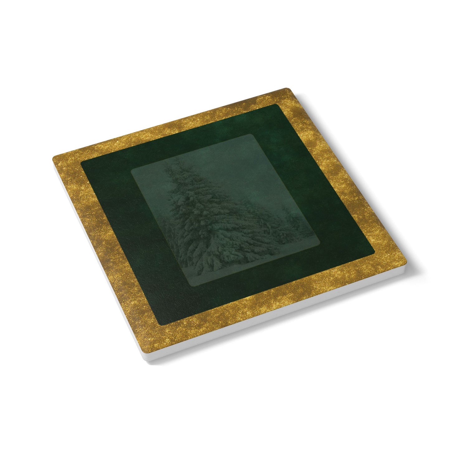 Velvet Solstice coaster shown at an angle highlighting square design, snowy fir print with green velvet and gold border, luxury holiday tableware by Printed Echoes Creations.